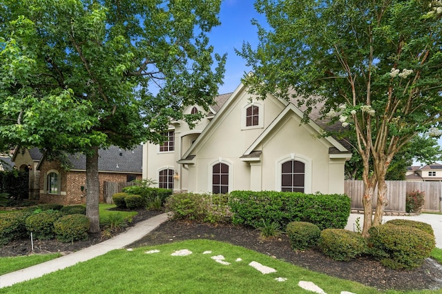 31318 Bearing Star Ln, Tomball, TX 77375 - french country home featuring stucco siding and a shingled roof