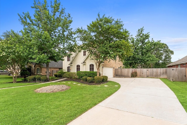 31318 Bearing Star Ln, Tomball, TX 77375 - view of front facade with concrete driveway, stucco siding, and an attached garage
