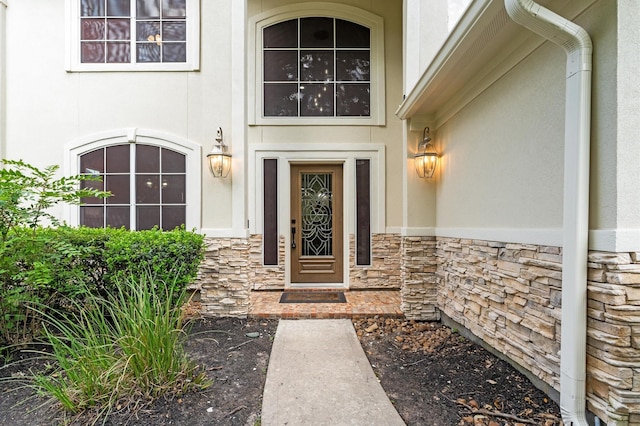 31318 Bearing Star Ln, Tomball, TX 77375 - doorway to property featuring stone siding and stucco siding