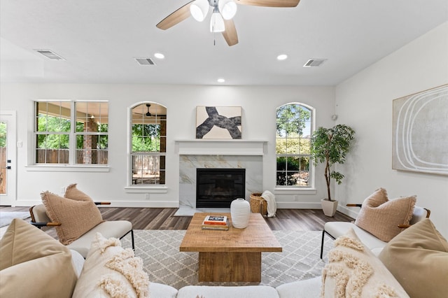 31318 Bearing Star Ln, Tomball, TX 77375 - living room with wood finished floors, a ceiling fan, baseboards, a fireplace, and recessed lighting
