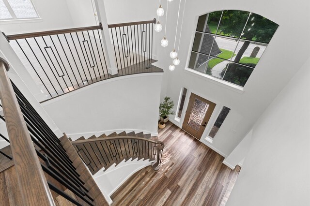 31318 Bearing Star Ln, Tomball, TX 77375 - entrance foyer featuring a high ceiling, stairway, and wood finished floors