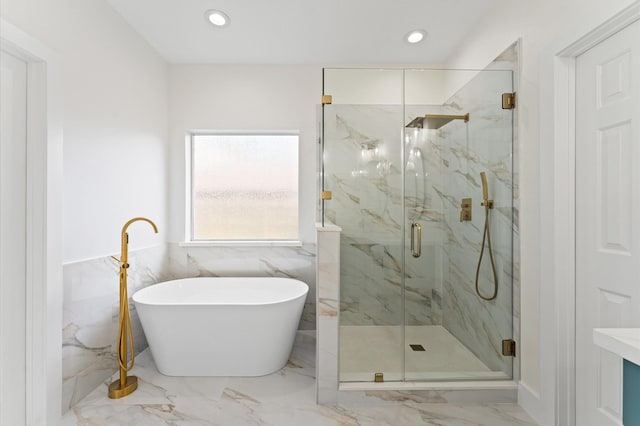 31318 Bearing Star Ln, Tomball, TX 77375 - bathroom with a marble finish shower, a freestanding tub, marble tiled flooring, and recessed lighting