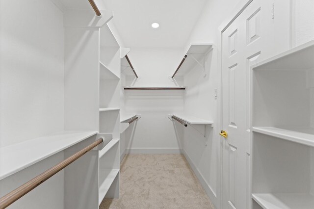 31318 Bearing Star Ln, Tomball, TX 77375 - walk in closet featuring light carpet