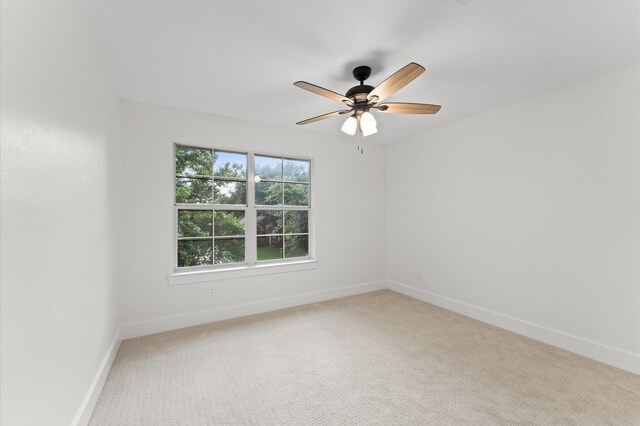 31318 Bearing Star Ln, Tomball, TX 77375 - unfurnished room featuring baseboards, light carpet, and ceiling fan