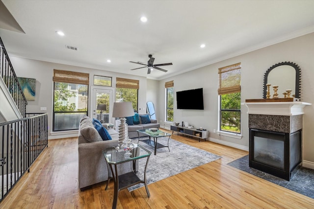 1814 Rosalie St, Houston, TX 77004 - living room with wood finished floors, a high end fireplace, ceiling fan, ornamental molding, and recessed lighting