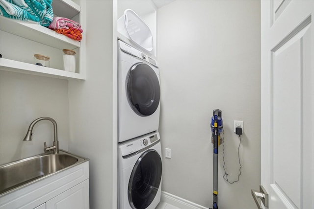 1814 Rosalie St, Houston, TX 77004 - washroom featuring stacked washer / drying machine and baseboards