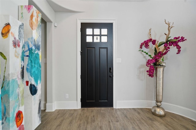 17464 Chestnut Cove Dr, Conroe, TX 77302 - foyer entrance with wood finished floors and baseboards