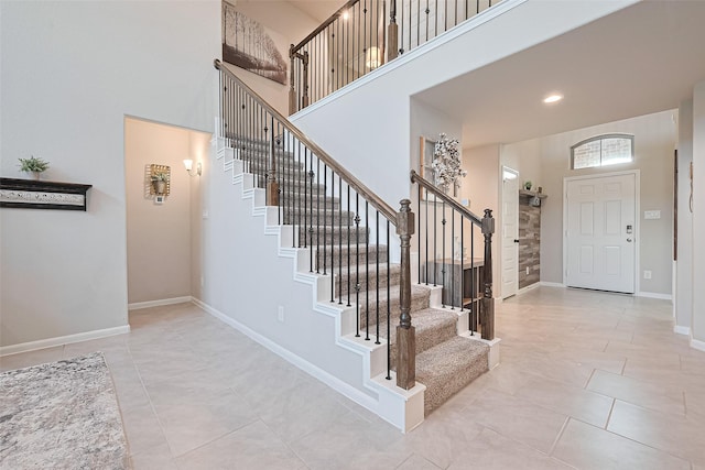 3415 Sicily Island Ln, Katy, TX 77494 - tiled entryway featuring a high ceiling, stairs, baseboards, and recessed lighting
