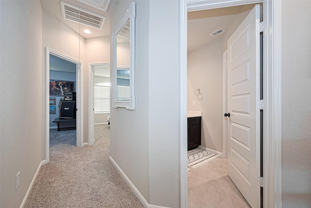 3415 Sicily Island Ln, Katy, TX 77494 - hallway featuring light carpet, baseboards, and attic access