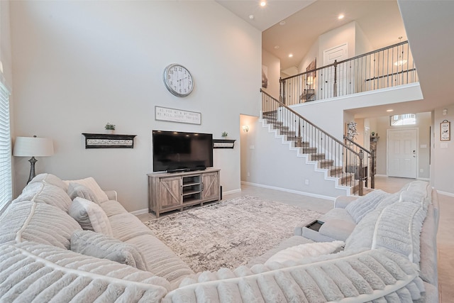 3415 Sicily Island Ln, Katy, TX 77494 - living room featuring a towering ceiling, stairway, baseboards, and recessed lighting