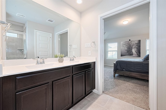 3415 Sicily Island Ln, Katy, TX 77494 - ensuite bathroom with double vanity, tile patterned floors, a shower with door, and baseboards