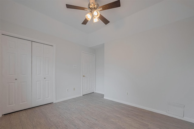 5210 Holly View Dr, Houston, TX 77091 - unfurnished bedroom featuring wood finished floors, baseboards, a closet, and a ceiling fan