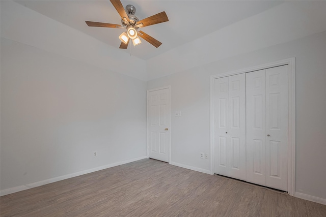 5210 Holly View Dr, Houston, TX 77091 - unfurnished bedroom featuring wood finished floors, baseboards, a closet, and ceiling fan