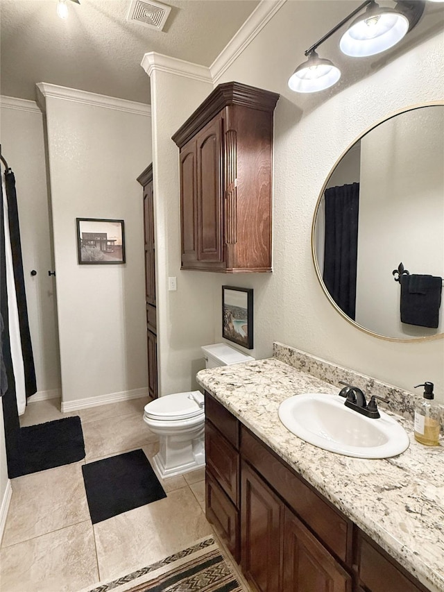 1549 Frontier Trl, Angleton, TX 77515 - bathroom with vanity, toilet, ornamental molding, baseboards, and tile patterned floors