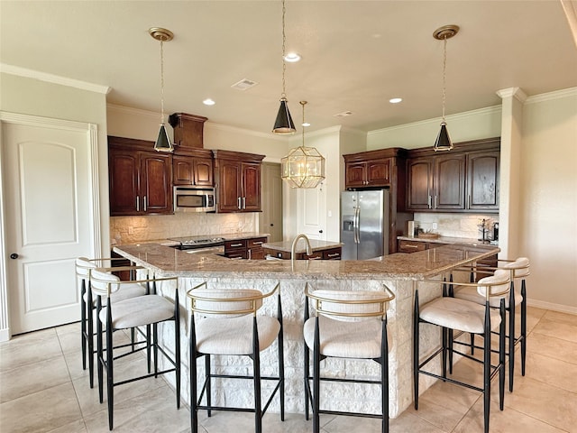 1549 Frontier Trl, Angleton, TX 77515 - kitchen with stainless steel appliances, a large island with sink, tasteful backsplash, light tile patterned floors, and recessed lighting