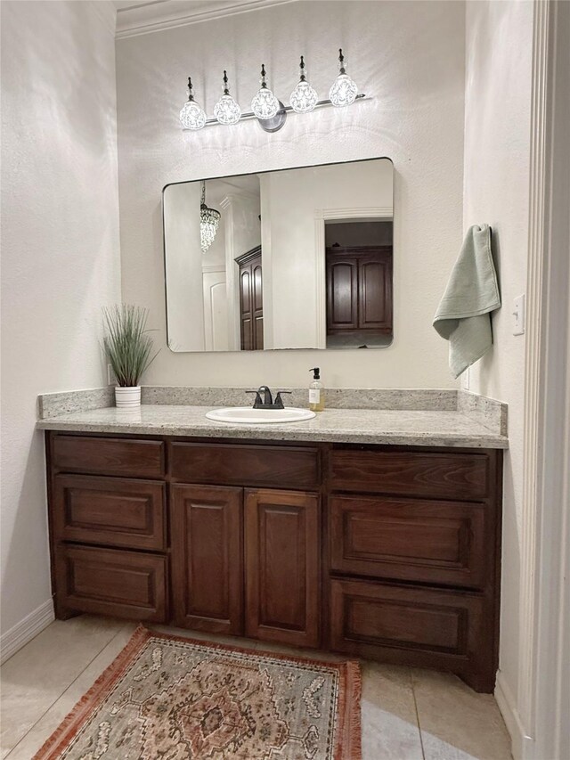 1549 Frontier Trl, Angleton, TX 77515 - bathroom with vanity, crown molding, baseboards, and tile patterned flooring