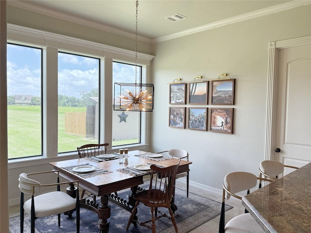 1549 Frontier Trl, Angleton, TX 77515 - dining room featuring plenty of natural light, crown molding, and baseboards