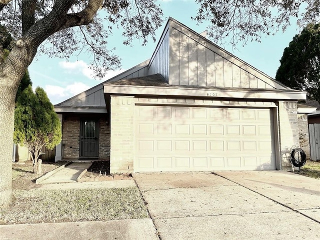 6207 Grandvale Dr, Houston, TX 77072 - view of front of house featuring brick siding, an attached garage, concrete driveway, and board and batten siding