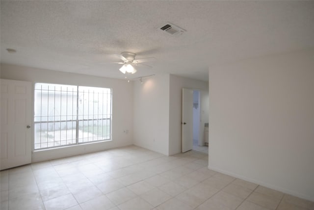 6207 Grandvale Dr, Houston, TX 77072 - empty room featuring a ceiling fan, a textured ceiling, and a smoke detector