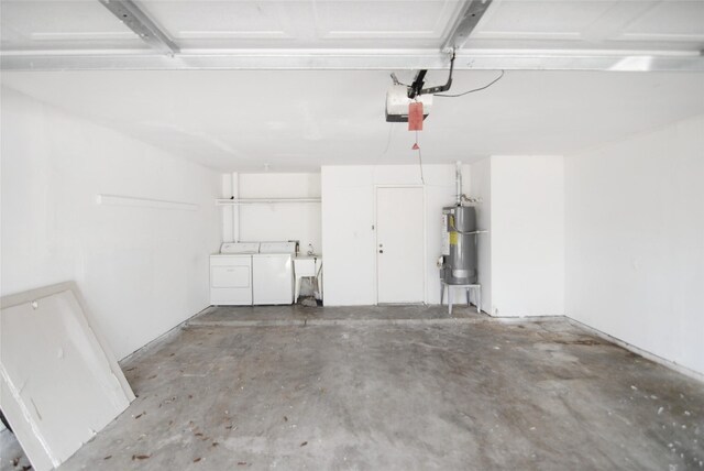 6207 Grandvale Dr, Houston, TX 77072 - garage with gas water heater, washing machine and clothes dryer, and a garage door opener