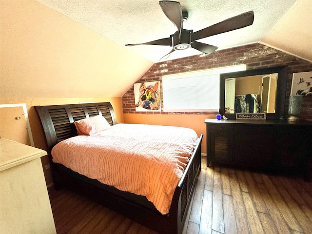 5301 Hemlock Dr, Baytown, TX 77521 - bedroom featuring vaulted ceiling, wood-type flooring, a textured ceiling, brick wall, and ceiling fan