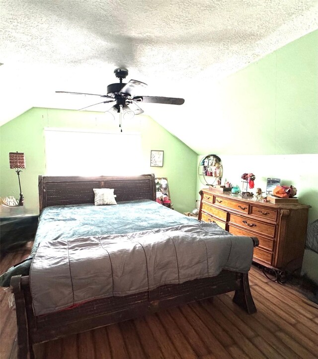 5301 Hemlock Dr, Baytown, TX 77521 - bedroom featuring lofted ceiling, wood finished floors, a textured ceiling, and a ceiling fan