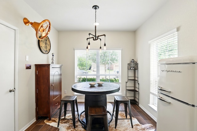3519 Barkers Run Dr, Houston, TX 77084 - dining area featuring dark wood-type flooring, plenty of natural light, and baseboards