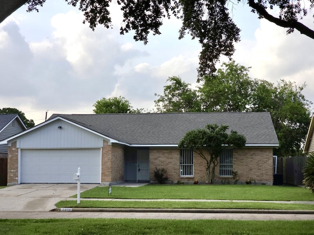 2806 W Greens Rd, Houston, TX 77067 - ranch-style home with an attached garage, driveway, brick siding, and a shingled roof