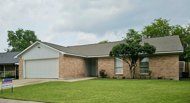 2806 W Greens Rd, Houston, TX 77067 - single story home with a garage, brick siding, driveway, and central AC