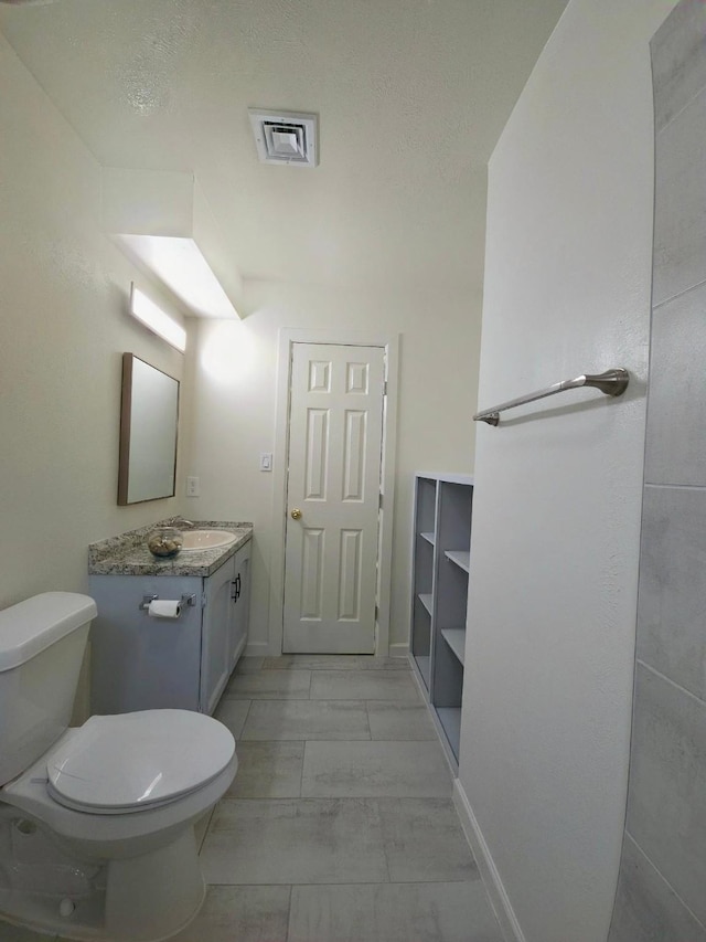 2806 W Greens Rd, Houston, TX 77067 - bathroom with toilet, vanity, marble finish flooring, and baseboards