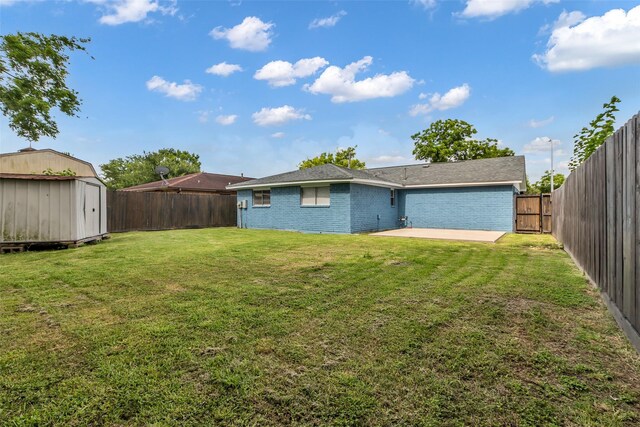 12127 Redfern Dr, Houston, TX 77048 - rear view of property featuring brick siding and a patio