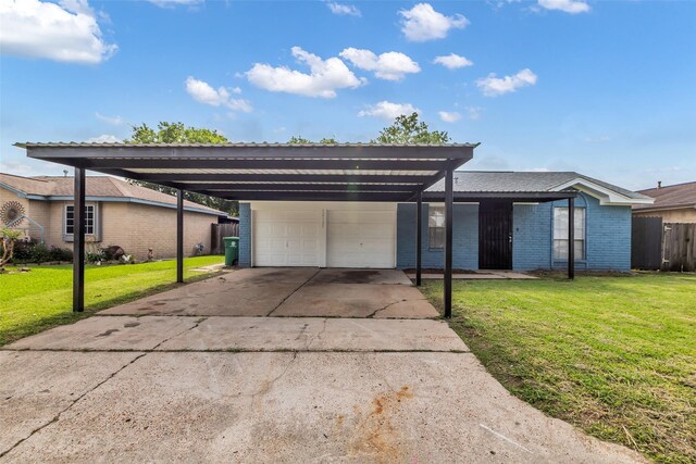 12127 Redfern Dr, Houston, TX 77048 - view of front of house featuring an attached garage, concrete driveway, brick siding, and a carport