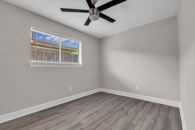 12127 Redfern Dr, Houston, TX 77048 - unfurnished room with wood finished floors, baseboards, and ceiling fan