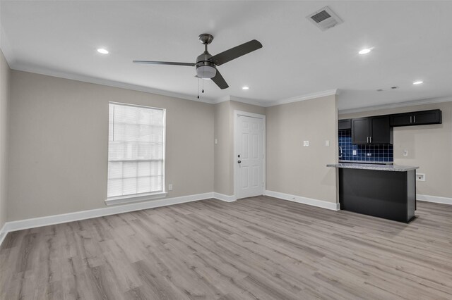 12127 Redfern Dr, Houston, TX 77048 - unfurnished living room with crown molding, ceiling fan, light wood-type flooring, baseboards, and recessed lighting