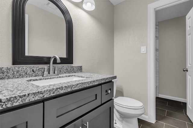 12127 Redfern Dr, Houston, TX 77048 - bathroom with tile patterned flooring, vanity, and toilet
