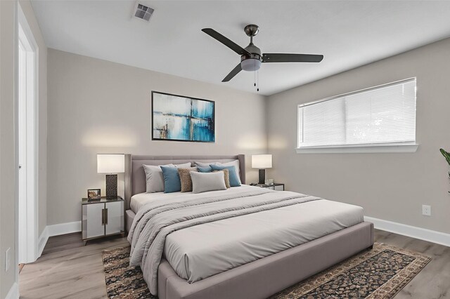12127 Redfern Dr, Houston, TX 77048 - bedroom with baseboards, wood finished floors, and ceiling fan