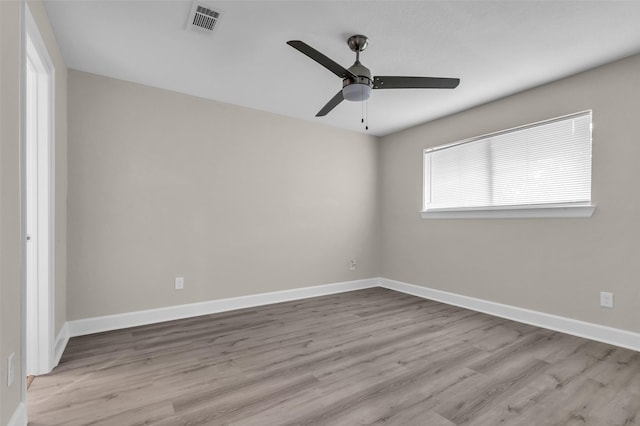 12127 Redfern Dr, Houston, TX 77048 - spare room with a ceiling fan, wood finished floors, and baseboards
