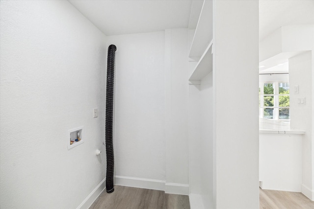 5542 Holly St Unit 205, Houston, TX 77081 - laundry room with washer hookup and wood finished floors