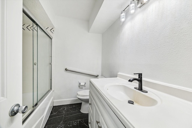 5542 Holly St Unit 205, Houston, TX 77081 - full bath featuring marble look tiles, vanity, and enclosed tub / shower combo