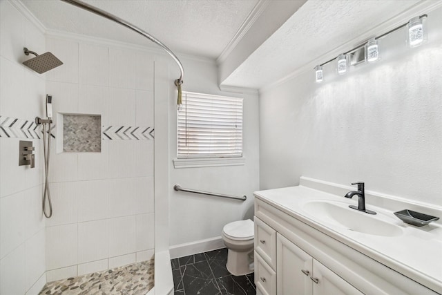 5542 Holly St Unit 205, Houston, TX 77081 - full bath with a tile shower, ornamental molding, vanity, and a textured ceiling