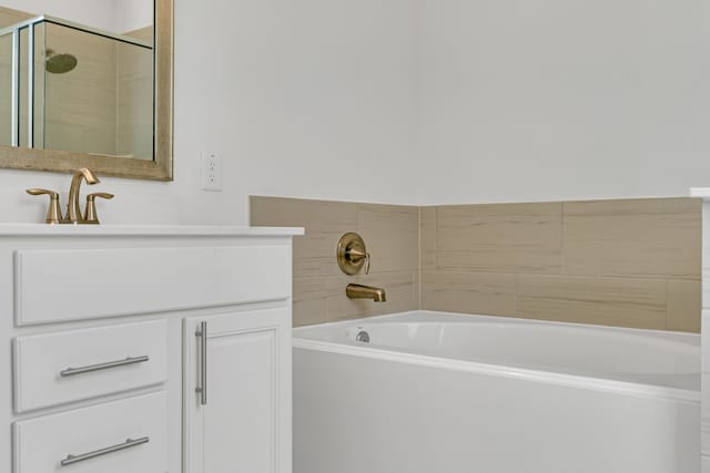 15307 Oakheath Colony Ln, Houston, TX 77044 - bathroom featuring a bath, vanity, and a stall shower