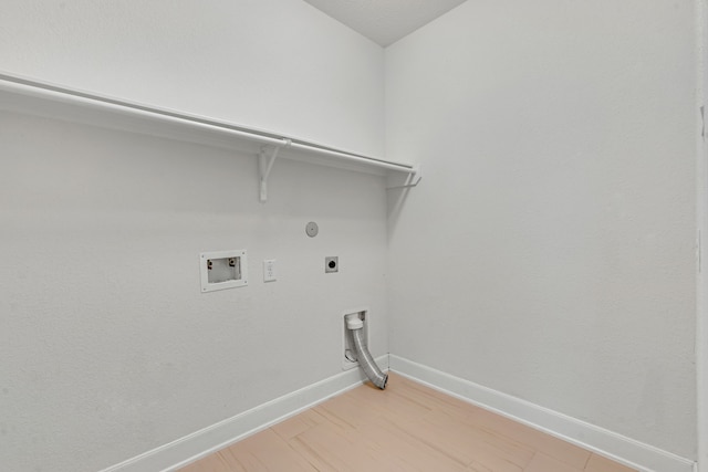 15307 Oakheath Colony Ln, Houston, TX 77044 - laundry room featuring electric dryer hookup, hookup for a gas dryer, washer hookup, and light wood-style flooring