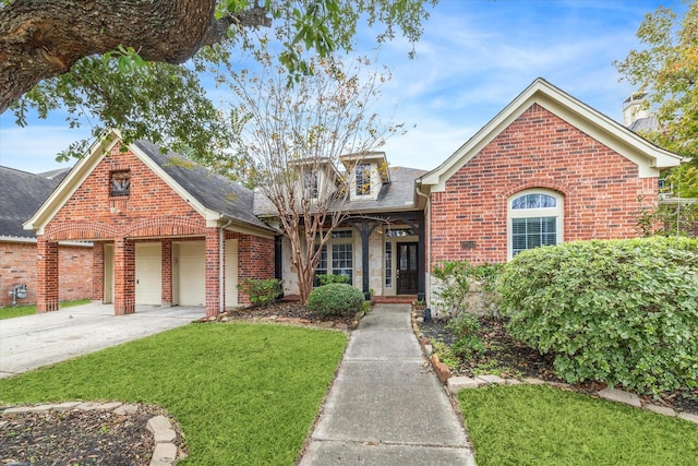 28519 Peper Hollow Ln, Spring, TX 77386 - traditional home featuring brick siding, a front lawn, driveway, a garage, and a chimney