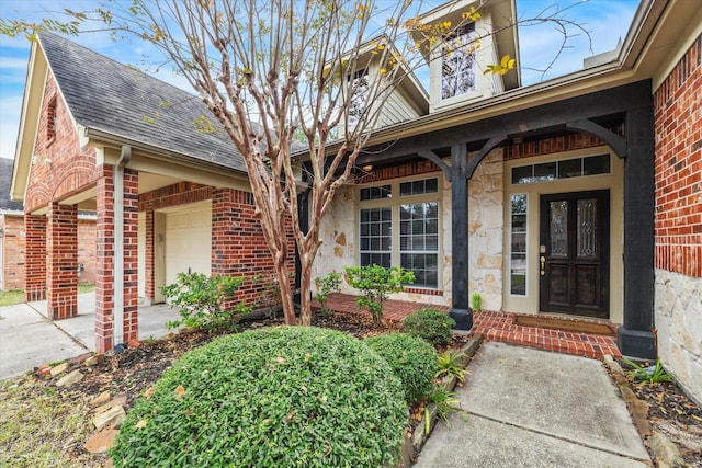 28519 Peper Hollow Ln, Spring, TX 77386 - property entrance featuring brick siding, roof with shingles, and french doors
