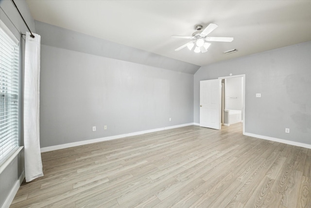 28519 Peper Hollow Ln, Spring, TX 77386 - unfurnished bedroom featuring light wood-style floors, vaulted ceiling, baseboards, and ceiling fan