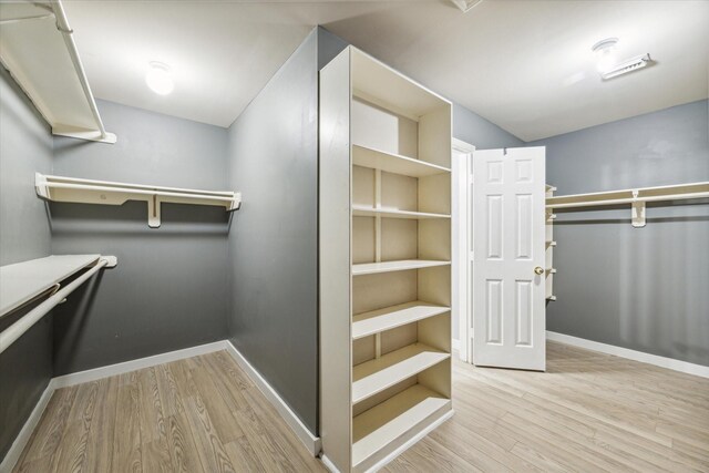 28519 Peper Hollow Ln, Spring, TX 77386 - walk in closet with wood finished floors