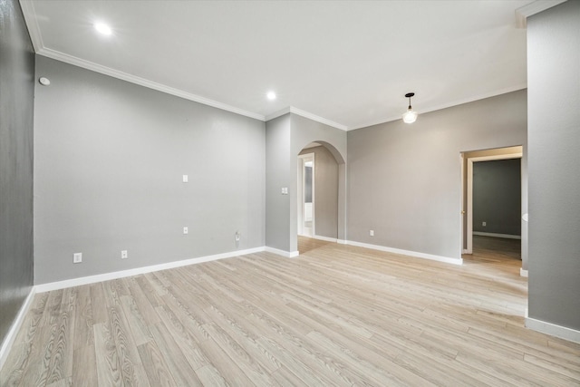 28519 Peper Hollow Ln, Spring, TX 77386 - unfurnished room featuring arched walkways, light wood-style flooring, ornamental molding, baseboards, and recessed lighting