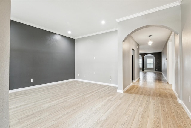 28519 Peper Hollow Ln, Spring, TX 77386 - unfurnished room featuring arched walkways, light wood-style flooring, baseboards, ornamental molding, and recessed lighting