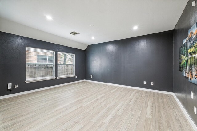 28519 Peper Hollow Ln, Spring, TX 77386 - spare room featuring light wood finished floors, recessed lighting, lofted ceiling, and baseboards