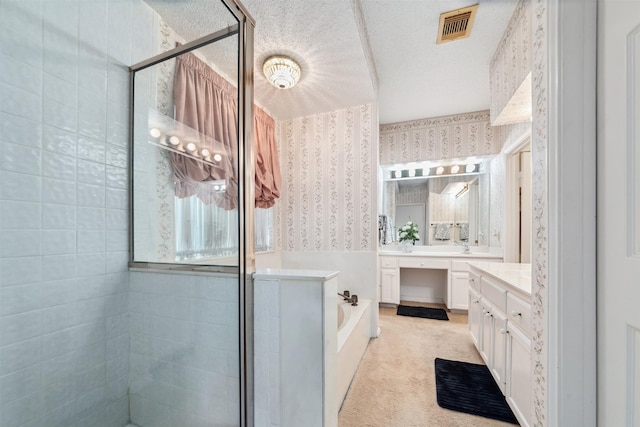 15118 Terrace Oaks Dr, Houston, TX 77068 - bathroom with wallpapered walls, a shower stall, vanity, a bath, and a textured ceiling